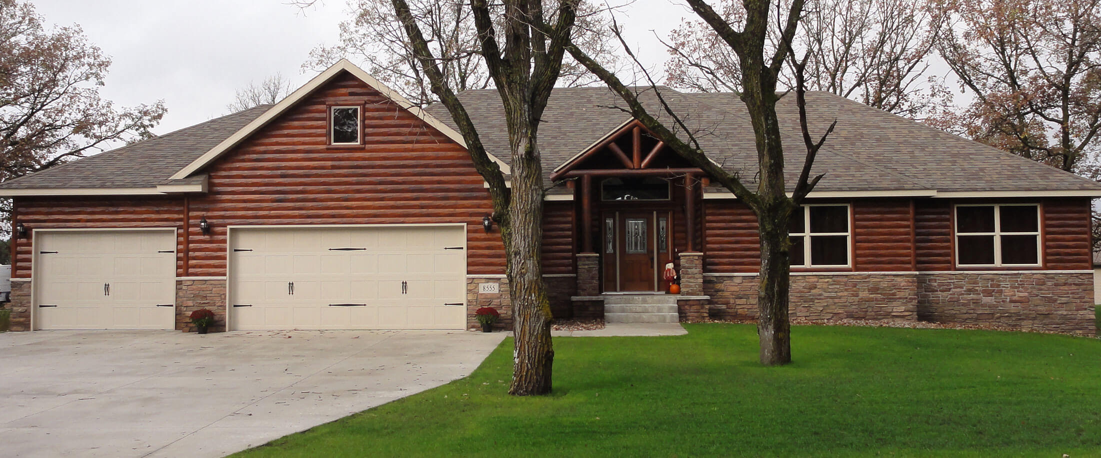 Exterior of a log style, single family home built by Lifestyle Lumber